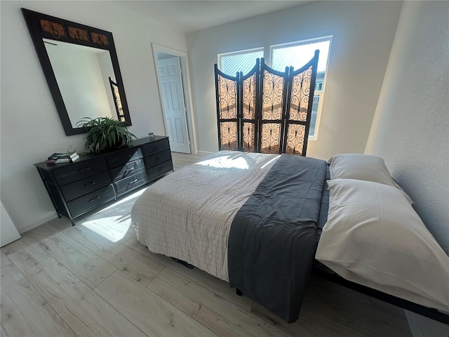 654 NW 9th Ave, Webster, FL 33597 - bedroom with light wood finished floors