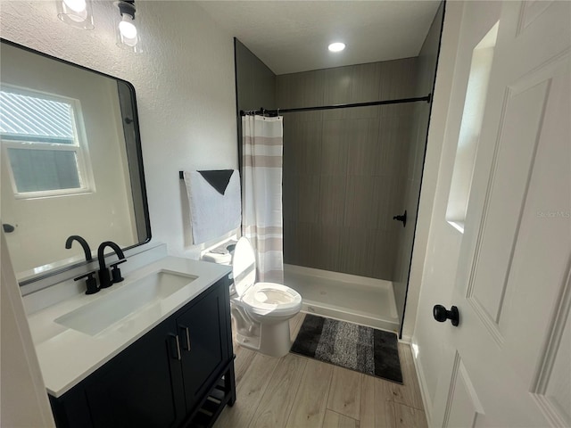 654 NW 9th Ave, Webster, FL 33597 - full bathroom featuring vanity, wood finished floors, and tiled shower