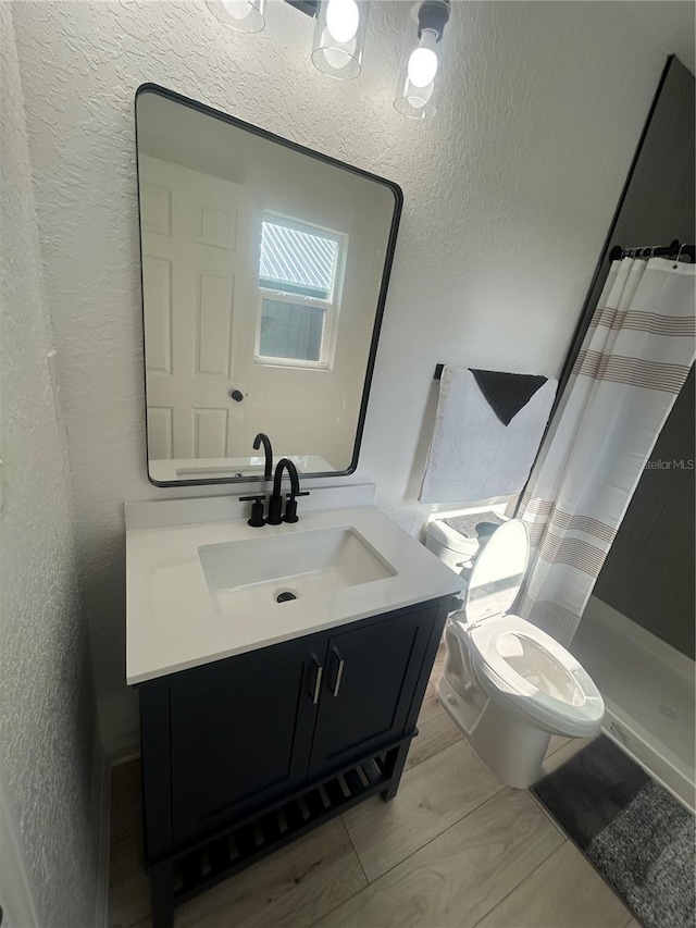 654 NW 9th Ave, Webster, FL 33597 - bathroom featuring a textured wall, vanity, and a shower with curtain