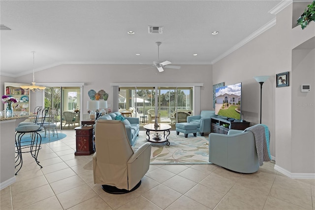 tiled living room featuring ceiling fan, lofted ceiling, and crown molding