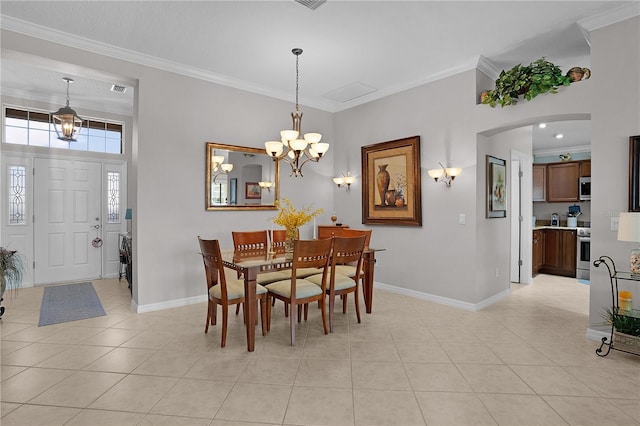 dining area featuring a notable chandelier, ornamental molding, and light tile patterned flooring