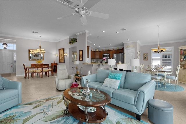 tiled living room with ceiling fan with notable chandelier and ornamental molding