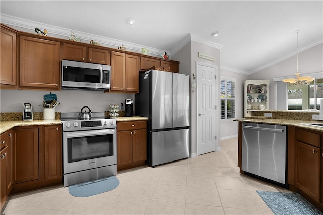 kitchen with lofted ceiling, decorative light fixtures, light tile patterned floors, appliances with stainless steel finishes, and crown molding