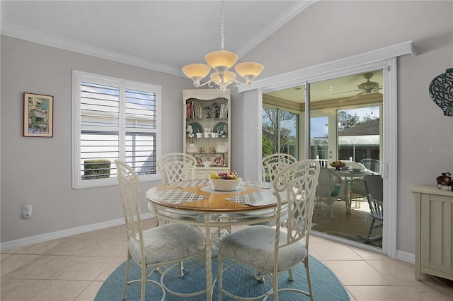 dining space featuring crown molding, an inviting chandelier, and light tile patterned floors