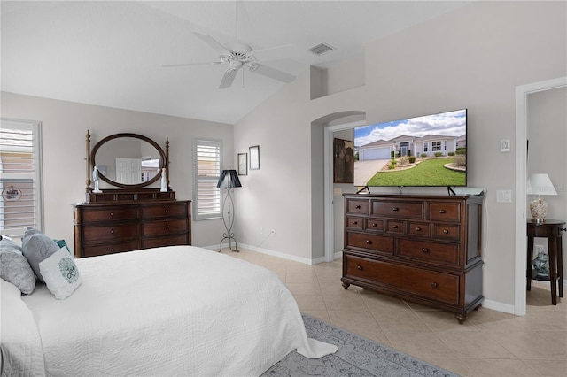 tiled bedroom with vaulted ceiling and ceiling fan