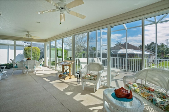 sunroom / solarium with ceiling fan