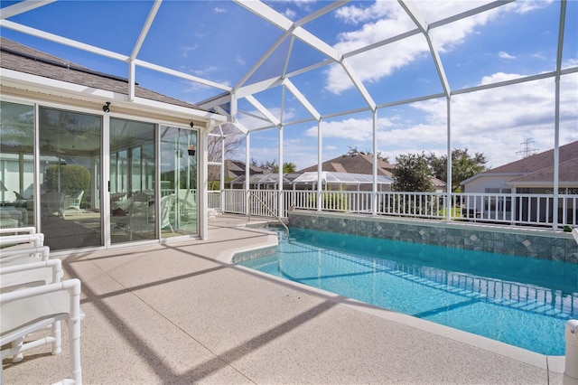 view of pool featuring a patio area and a lanai