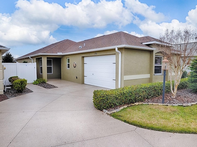 ranch-style house featuring a garage