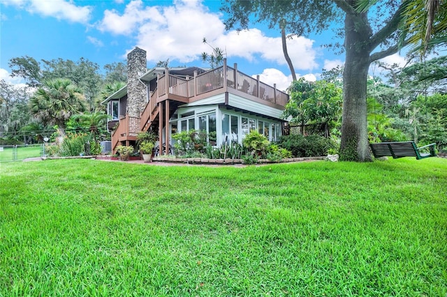 rear view of house with a yard