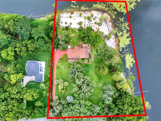 birds eye view of property with a water view