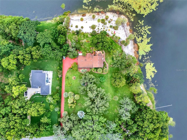 birds eye view of property with a water view