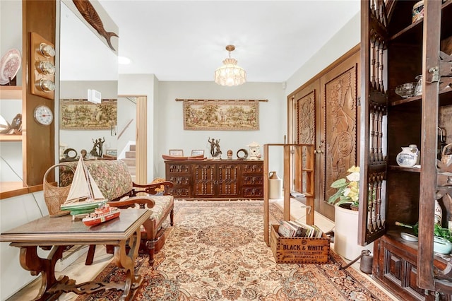 hall featuring tile patterned floors and an inviting chandelier