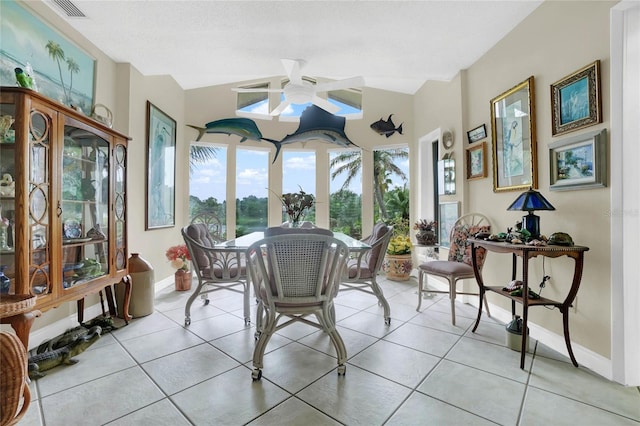 sunroom featuring vaulted ceiling and ceiling fan