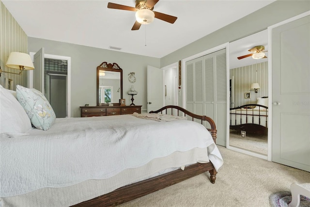 carpeted bedroom with a closet and ceiling fan