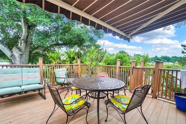 wooden deck featuring outdoor lounge area