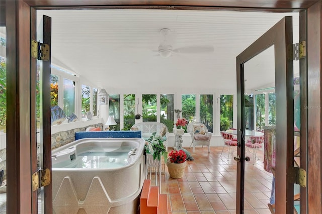 sunroom / solarium featuring a jacuzzi and a wealth of natural light