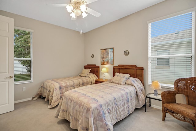 bedroom with light carpet and ceiling fan