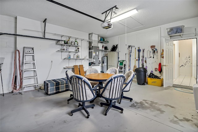 garage with a garage door opener and water heater