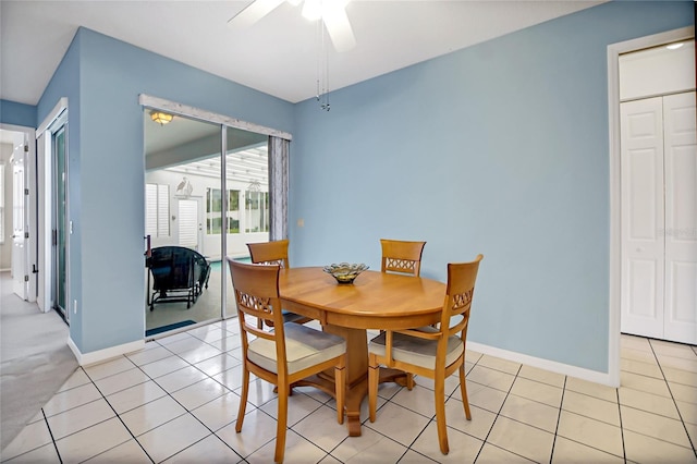 tiled dining area with ceiling fan