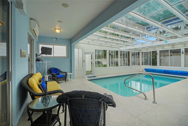 view of pool featuring a patio and an AC wall unit