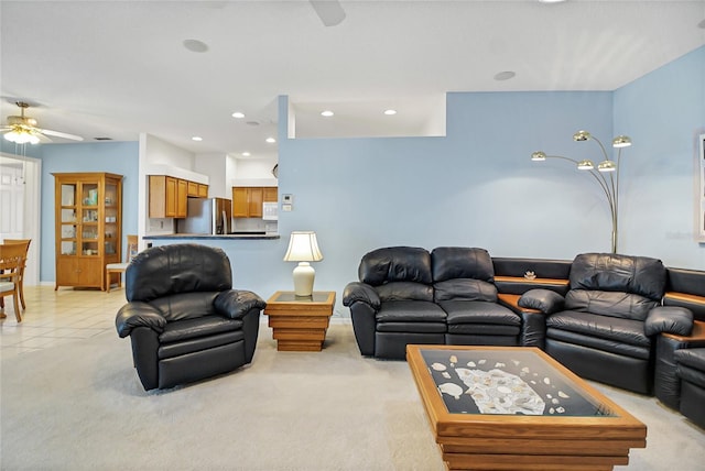 living room with ceiling fan and light carpet