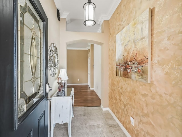 interior space featuring crown molding and light tile patterned flooring