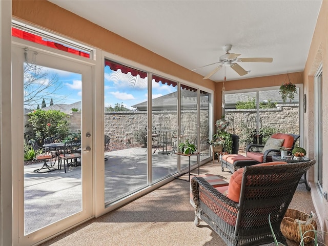 sunroom with plenty of natural light and ceiling fan