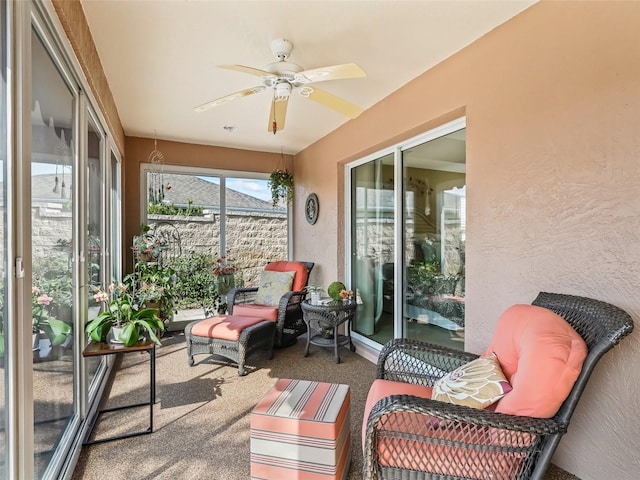 sunroom / solarium with ceiling fan