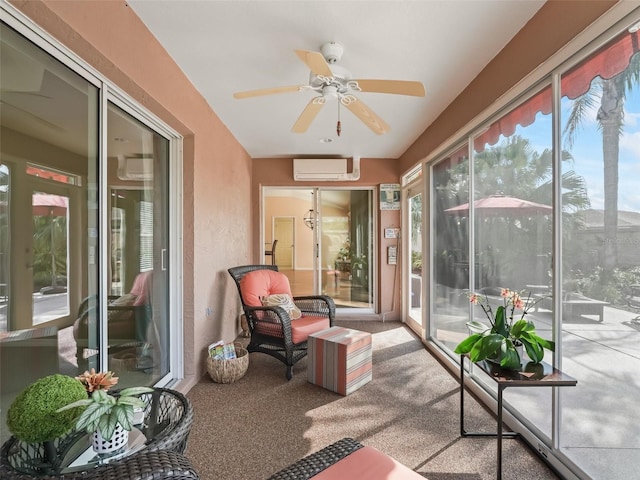 sunroom / solarium with a wall mounted air conditioner and ceiling fan