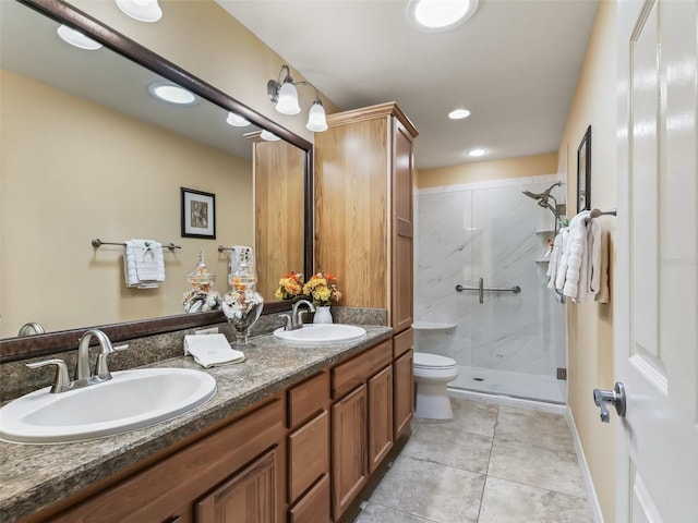 bathroom featuring vanity, an enclosed shower, tile patterned floors, and toilet