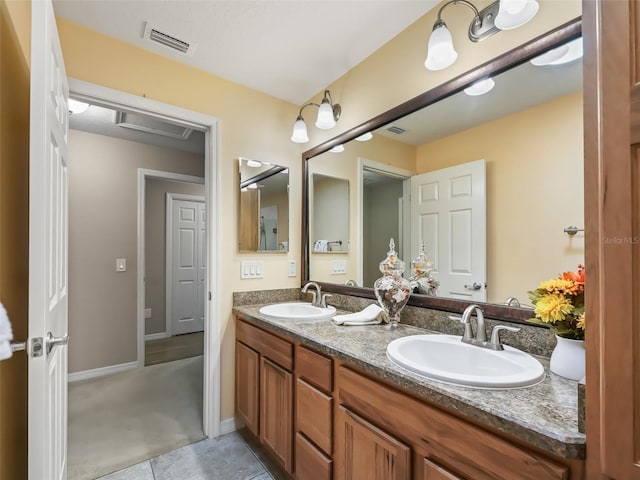 bathroom with vanity and tile patterned floors