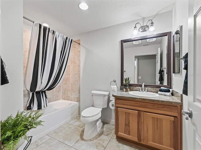 full bathroom featuring shower / tub combo, vanity, toilet, and tile patterned flooring