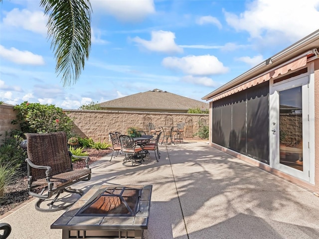 view of patio / terrace with a fire pit