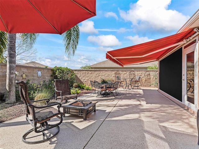 view of patio / terrace featuring an outdoor fire pit