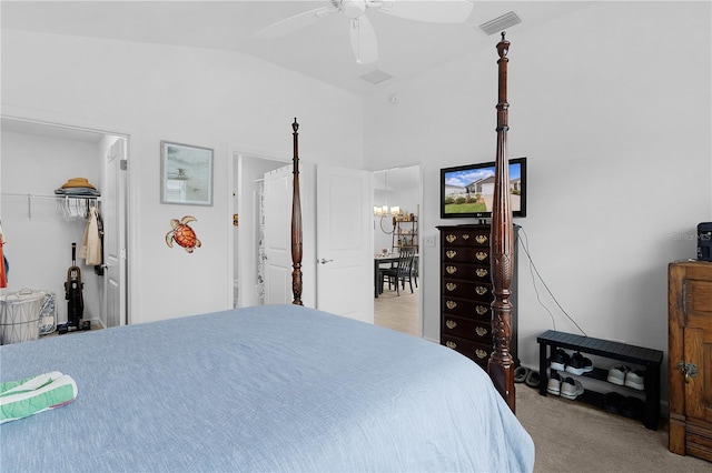 bedroom featuring lofted ceiling, light colored carpet, and ceiling fan