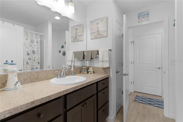 bathroom featuring hardwood / wood-style flooring and vanity