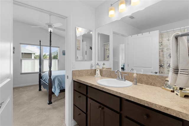 bathroom featuring vanity, lofted ceiling, and ceiling fan