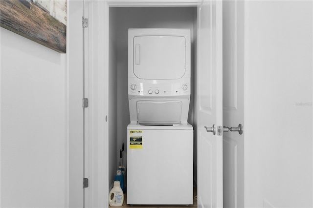 laundry room featuring stacked washer and clothes dryer