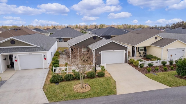 single story home with a garage and a front lawn