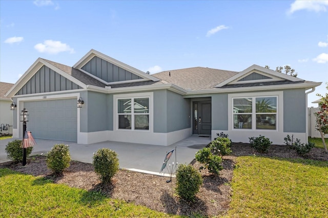 view of front of house featuring a garage and a front yard