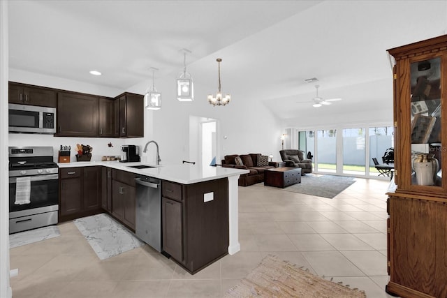 1392 Kenneth St, The Villages, FL 34762 - kitchen featuring appliances with stainless steel finishes, sink, pendant lighting, and kitchen peninsula