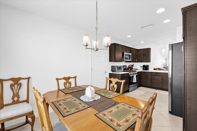 1392 Kenneth St, The Villages, FL 34762 - tiled dining room featuring a notable chandelier