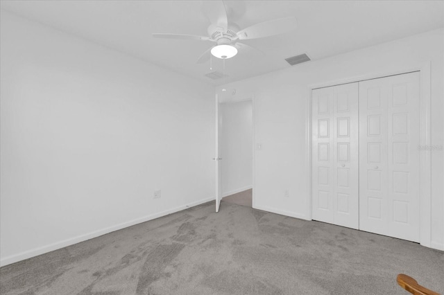 1392 Kenneth St, The Villages, FL 34762 - unfurnished bedroom with ceiling fan, carpet flooring, and a closet