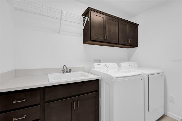 1392 Kenneth St, The Villages, FL 34762 - laundry area featuring sink, cabinets, and washing machine and clothes dryer