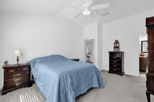 1392 Kenneth St, The Villages, FL 34762 - bedroom with light carpet, lofted ceiling, ceiling fan, and ensuite bathroom