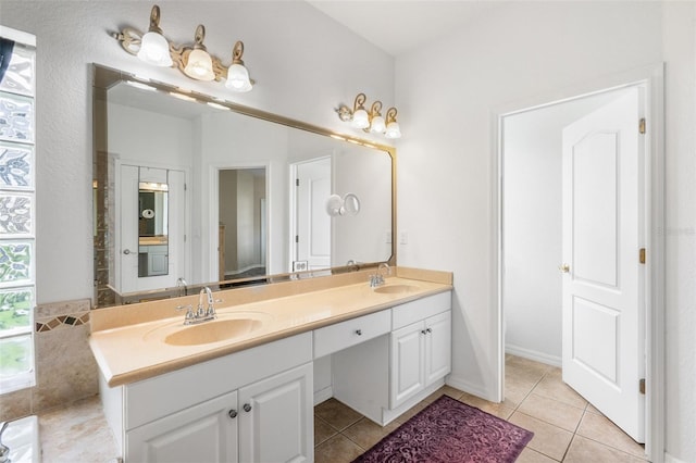 bathroom with tile patterned flooring and vanity