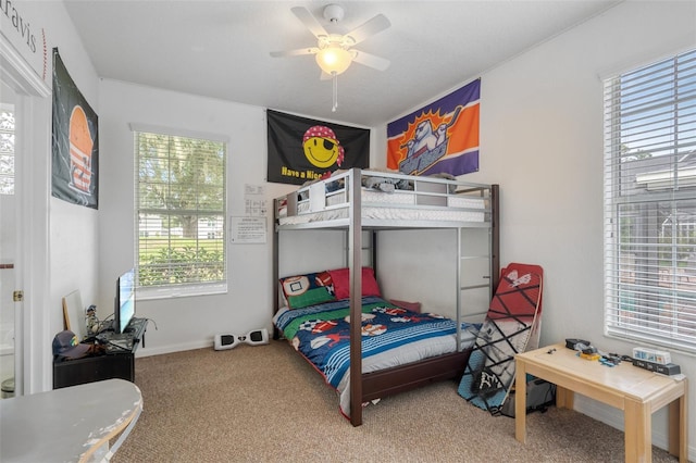 carpeted bedroom with ceiling fan