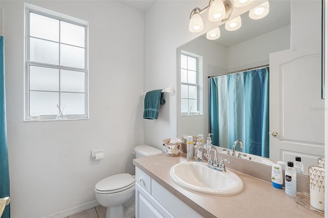 bathroom with tile patterned floors, vanity, and toilet