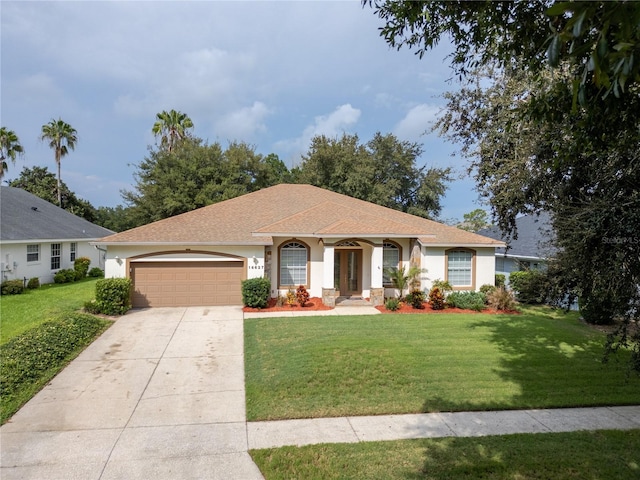 single story home with a garage and a front yard