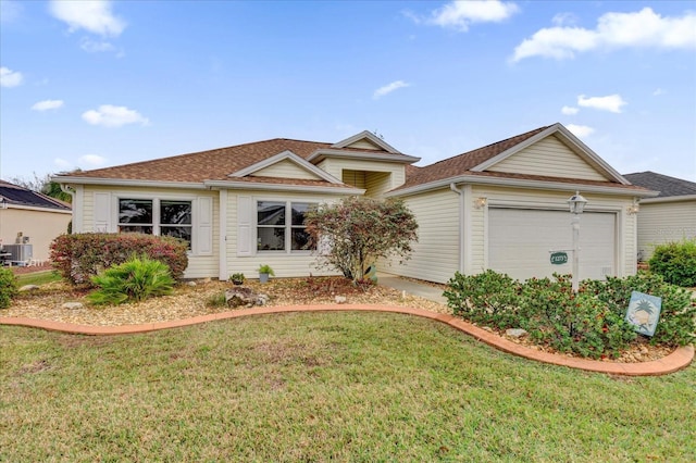 single story home with a garage, cooling unit, and a front yard